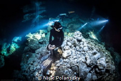 Freediver in Cenote Tajma-ha by Nick Polanszky 